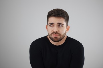apprehensive and distrustful man looking at the fearful, distressed and agonized side - whit space for caption or text