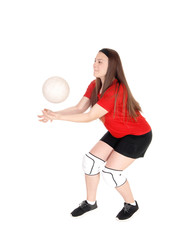 Young girl playing volley ball