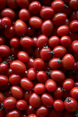 Red cherry tomato food background, close-up, top view. 