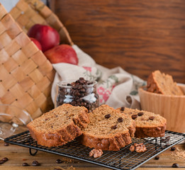 Cake with cocoa and chocolate on a wooden table. Sweet homemade pastries for breakfast. Rustic style photo.