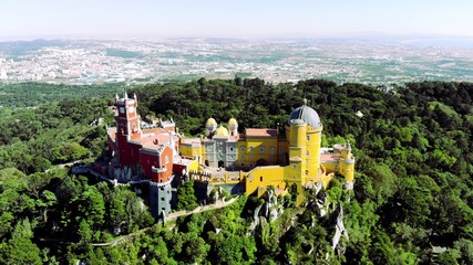 Fototapeta na wymiar Aerial view of the beautiful Pena Palace (Palacio da Pena) in Sintra, Portugal; Concept for travel in Portugal