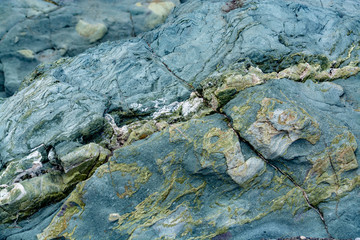 Background with green mineral rock close up, gemstone texture, olivine, amazonite, amphibolite