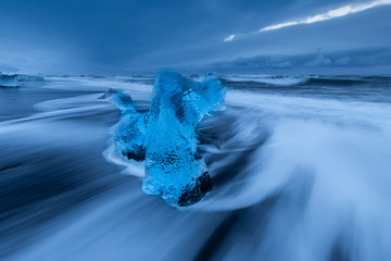 Iceland Jokulsarlon ice beach in winter morning blue hour with blue ice in slow exposure