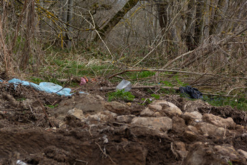 Plastic waste thrown around nature