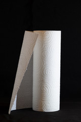 White paper kitchen roll isolated on balck background