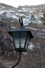 Street light as a lantern with snowy mountains behind for a good composite or editing