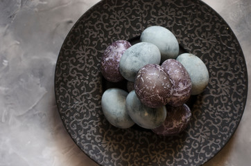 Easter eggs on a beautiful black plate