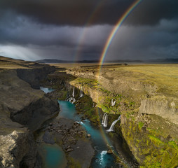 double rainbow after iceland storm on Sigöldugljufur waterfall in landmannalaugar