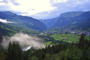View of Grindelwald from high ground showiıng beautiful village in green nature