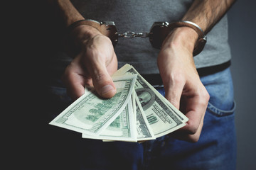 hand money and handcuffs
