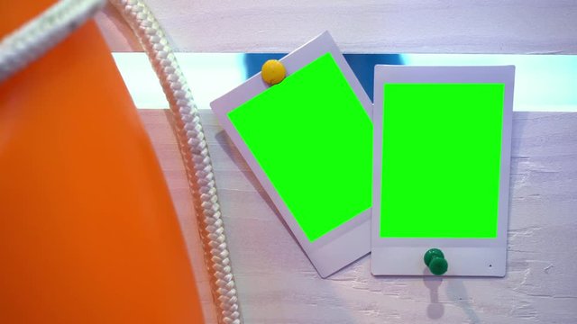 The photo. Photo frame with green background. Hromakey. Green screen. Photos attached to wooden boards. Memory. Story. Family photos. A party