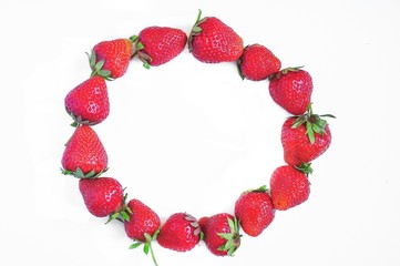 Red strawberries on a white background. Red berries. Berries for the cake. Strawberry basket. A group of berries. Fresh fruit and juicy fruit for fruit drink.