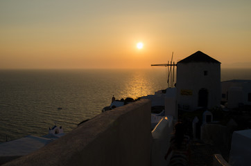 sunset sky at the beautiful white village of Oia Santorini Greece