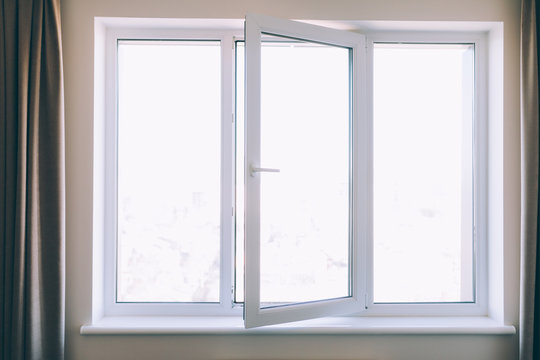 Close up opened white plastic pvc window at home