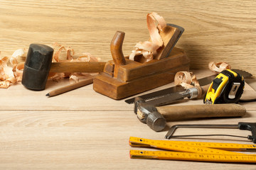 Carpentry concept.Joiner carpenter workplace. Different tools on wooden table. Copy space for text.