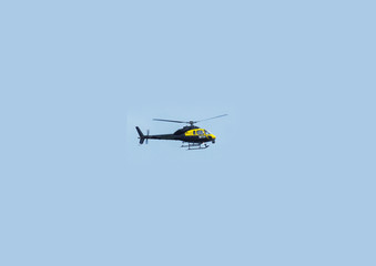 Fototapeta na wymiar Helicopter Chopper black with blue sky background for editors text copy