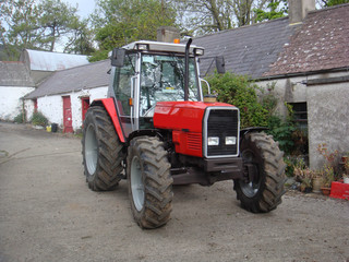 Red Tractor on Farmyard