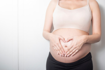 Close up pregnant woman expecting a baby