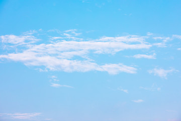 Blue sky background and white clouds soft focus, and copy space