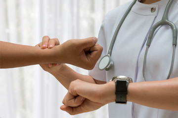 Asian Nurse check Patient pulse by close up shotting