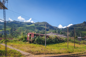 Fototapeta na wymiar Abandoned train car in the fields of Sri Lanka. Travel to Asia, the popular holiday destination of Ceylon