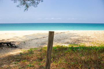 wooden sign on the beach