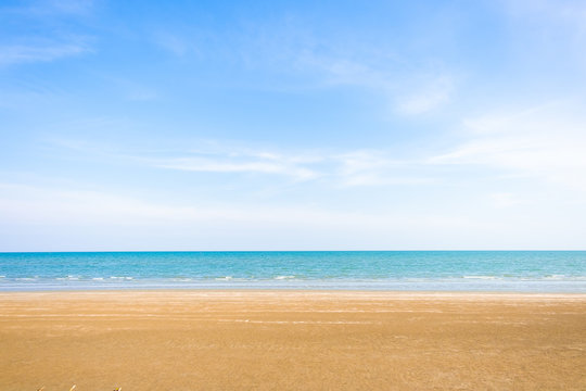 Abstract beach background. Yellow sand, blue sky and calm tropical beach landscape.Exotic nature concept.Location Satheep Thailand