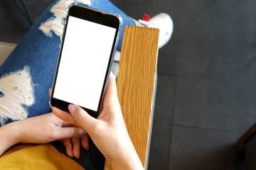 Women's hands holding cell telephone blank copy space screen. Smart phone with