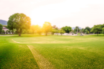 Golf course in the countryside sunset as background