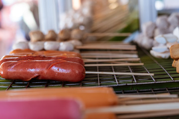 Grilled meat ball and sausage on electric grill.Meat ball made from chicken, meat , beef or pork.