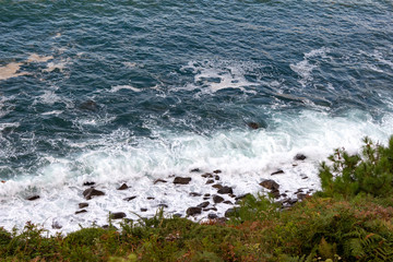 Sea waves with foam top view