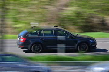 Fototapeta na wymiar european car drivers in their cars on a sunny day with blurred background