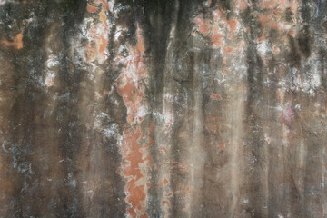 Dirty orange concrete wall.