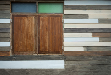 Classic window on red wood wall background.