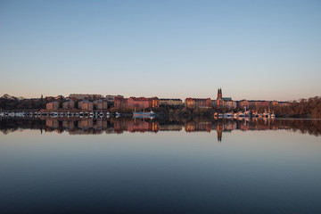 View over old houses in the Södermalm district a spring day at sunrise in Stockholm from the Norrmälarstrand pier