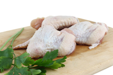 raw chicken wing with parsley