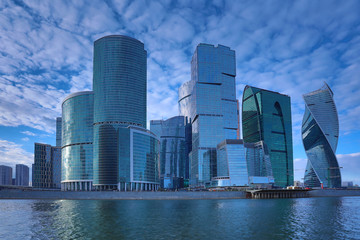 Moscow/ Russia April 19 2019: The unique skyscraper of Moscow city, the modern office center in the heart of capital of Russia in the evening in the rays of setting sun on the bank of Moskva river