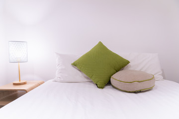 Fototapeta na wymiar Modern white bedroom with standing light