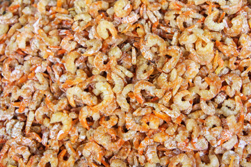 Stack of many dried shrimp on fish market jetty. For seafood, food, kitchen, texture and background.