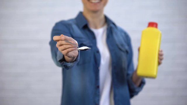 Female choosing soda instead chemical detergents, organic cleaners concept