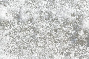 Abstract snow texture. Early spring snow background close up