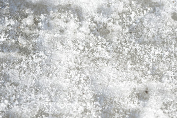 Abstract snow texture. Early spring snow background close up
