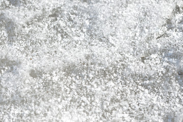 Abstract snow texture. Early spring snow background close up
