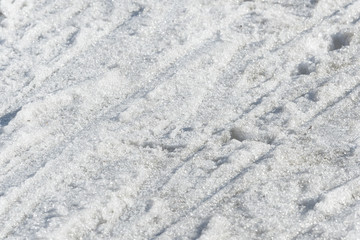 Abstract snow texture. Early spring snow background close up
