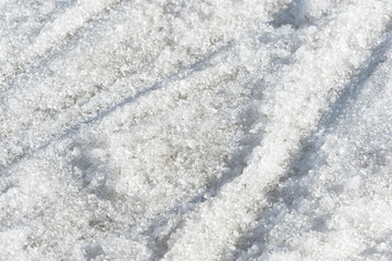 Obraz premium Abstract snow texture. Early spring snow background close up