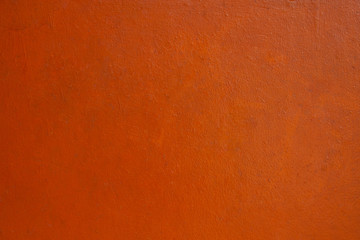 Horizontal Orange color concrete wall background.  Concrete wall textured for backdrop or background.