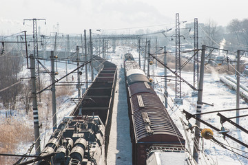 Fototapeta premium rail cars loaded with coal being transported from nearby mines to power plants in winter