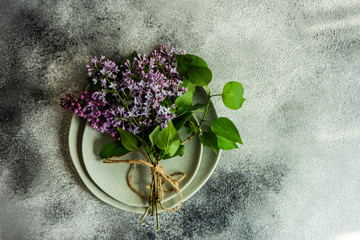 Fototapeta na wymiar Spring table setting with lilac