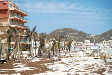 Philipsburg Sint maarten: Board walk and buildings completely covered with beach sand and debris after island got hit by hurricane Irma. 