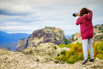 Woman take photo from Meteora monastery